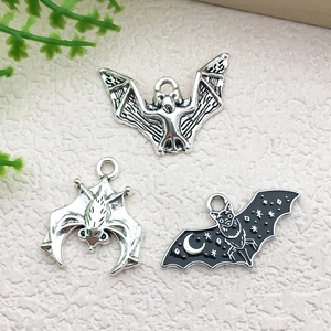 Detailed set of silver and black enamel bat charms for DIY Halloween jewelry making
