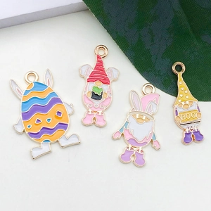 Detail of colorful Easter bunny and gnome alloy pendants with glossy enamel finish