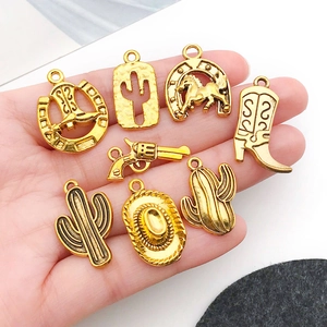 Set of 8 vintage gold alloy western cowboy pendants with cactus and horseshoe shapes