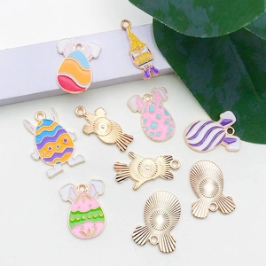 Detail of colorful Easter bunny and gnome alloy pendants with glossy enamel and gold plating