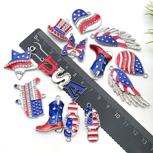 Macro detail of USA flag theme enamel alloy charms with crystal accents and scale