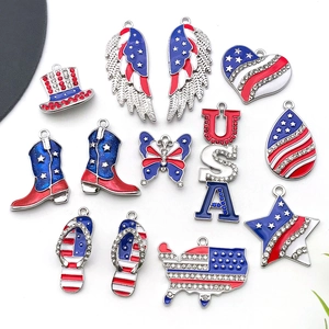 Macro shot of 13 USA flag themed alloy charms with stars stripes and rhinestones