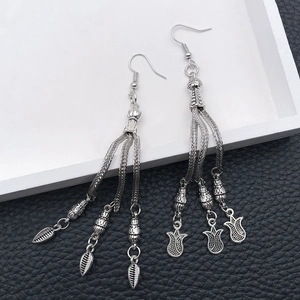 Vintage silver tassel earrings with delicate leaf and tulip pendants in ethnic style