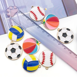 Detailed view of alloy sports ball charms next to a ruler showing 20mm size and enamel finish
