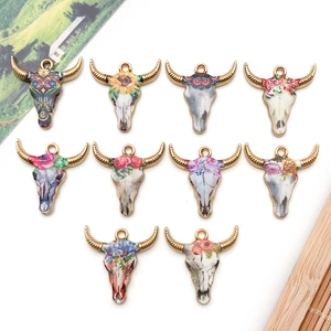 DIY boho enamel bull skull charms with colorful floral patterns and gold plating