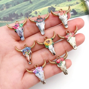 Set of 8 colorful enamel bull skull charms with floral patterns for DIY jewelry making