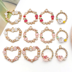 Detail of floral and fruit alloy charms with pearls and rhinestones for DIY jewelry making