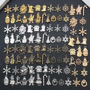 Detailed collection of vintage Christmas alloy charms in gold, silver and bronze finishes