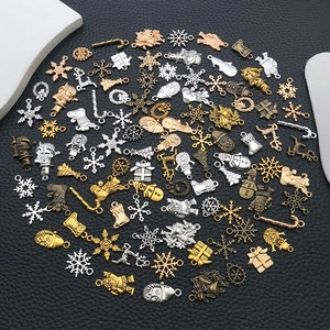 Assorted Christmas alloy pendants including snowflakes and bells in four metallic colors