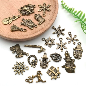 Mix di 20 ciondoli natalizi in bronzo vintage con fiocco e cervo per gioielli fai da te
