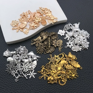 Macro shot of vintage style metal Christmas pendants in diverse metallic finishes