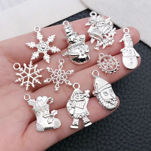 Set of 9 silver plated Christmas charms including snowflakes and reindeer for DIY jewelry