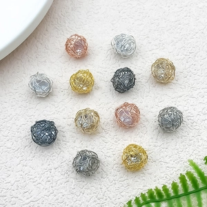 Detailed wire-wrapped hollow bead pendants in four metallic colors for DIY jewelry making