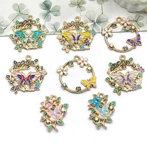 Kleurrijke emaille bloem- en vlinderhangers van legering voor het maken van DIY-sieraden