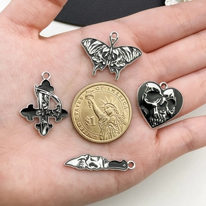 Gothic skull charms including butterfly, heart and cross motifs for DIY jewelry making