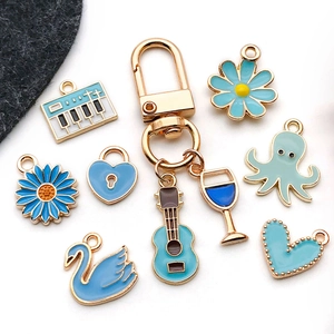 Mix of 20 blue enamel alloy charms with guitar, octopus and daisy shapes for DIY jewelry
