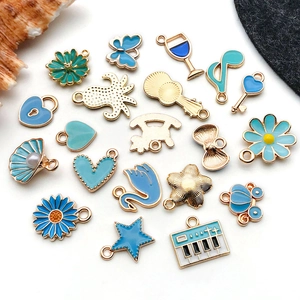 Detailed close-up of blue enamel alloy charms for DIY bracelets and necklaces