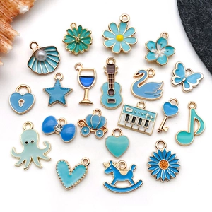Macro detail of mixed blue enamel alloy pendants for DIY bracelets and necklaces