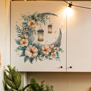 Close-up of crescent moon and floral wall sticker on a white cabinet in home setting
