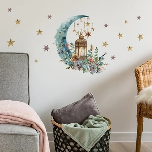 Detail of blue moon and floral wall decal with stars on cream bedroom wall decor