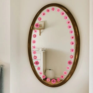 Elegant 3D pink floral wall stickers arranged as a wreath on a mirror for home decor