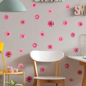 Pink floral wall stickers for home decor shown on a gray wall with minimalist chair