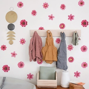 Pink and magenta 3D floral wall stickers for bedroom decoration in a cozy home setting