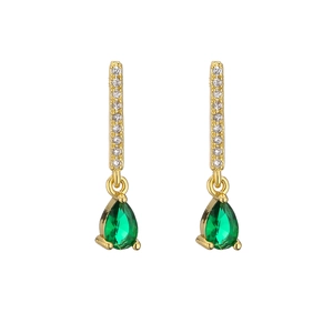 Macro detail of 18K gold plated drop earrings featuring green zircon teardrop pendants