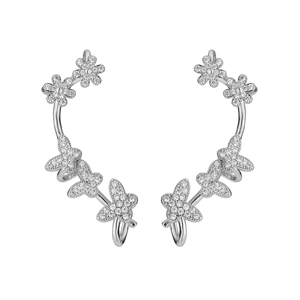 Macro detail of silver ear cuffs with butterfly patterns and micro-pave zircons