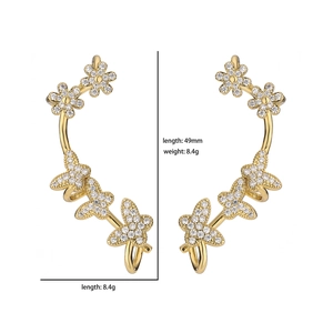 Detailed view of micro-pave zircon gold flower ear cuff measuring 49mm in length