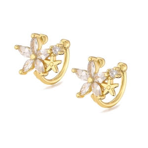 Gold flower and star ear cuffs with micro-pave cubic zirconia on a white background