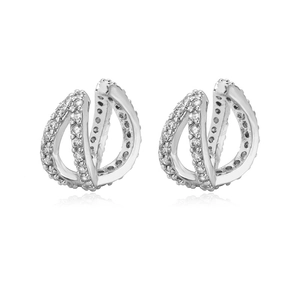 Detail of silver crossover hoop earrings with micro-pave cubic zirconia on white background