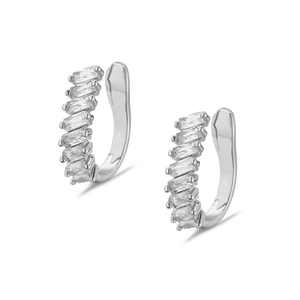Close-up of baguette-cut zircon ear cuffs with polished silver finish and micro-inlays