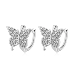 Detailed view of silver butterfly ear cuffs with micro-paved cubic zirconia crystals