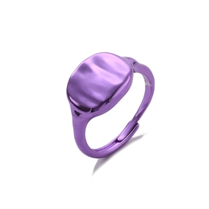 Macro shot of purple plated ring with modern wavy texture and adjustable open band