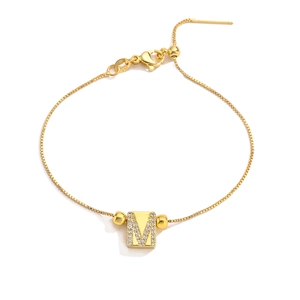 Adjustable golden box chain bracelet featuring a cubic zirconia micro-pave letter M charm