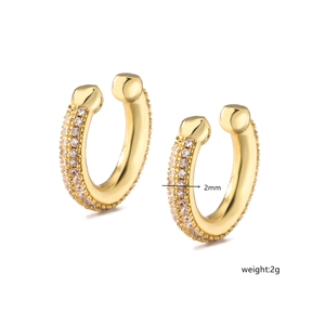 Macro detail of 2mm wide gold-plated brass ear cuffs with micro-pave cubic zirconia stones