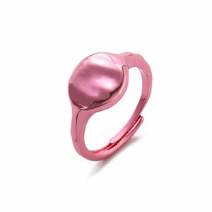 Detail view of pink metal minimalist ring with adjustable open band and smooth finish
