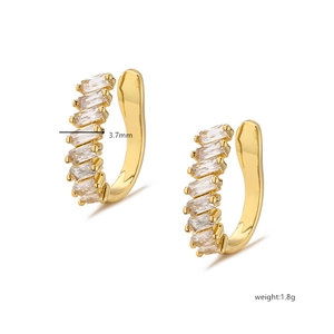 Macro detail of gold plated ear cuff with baguette zircons showing 3.7mm width and weight