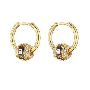 Detail of gold evil eye hoop earrings with blue enamel and sparkling cubic zirconia