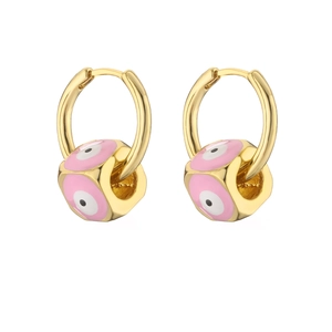 Detail of gold hoop earrings featuring pink enamel dice charms with evil eye design