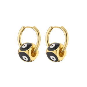 Detail of gold evil eye drop earrings with black enamel and cubic zirconia stones