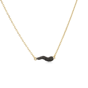 Detailed macro view of gold chain with curved wave pendant micro-paved in black stones
