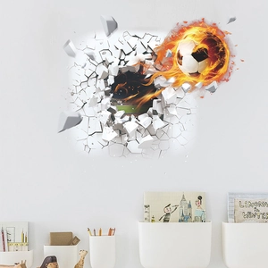 3D football wall decal showing a flaming soccer ball breaking through a white wall