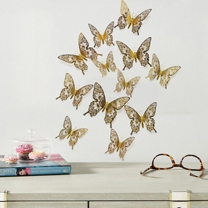 Set of 12 golden 3D hollow butterfly wall stickers with elegant paper-cut style wing detail