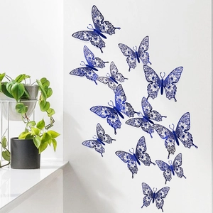 Detail of 3D hollow blue butterfly wall stickers with intricate laser-cut floral patterns
