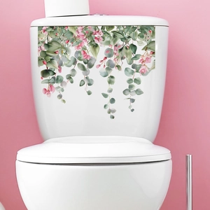 Close-up of waterproof toilet sticker featuring pink flowers and eucalyptus leaf motifs