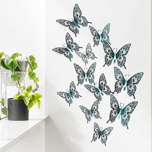 3D hollow carved butterfly wall stickers in deep blue with plant decor on white wall