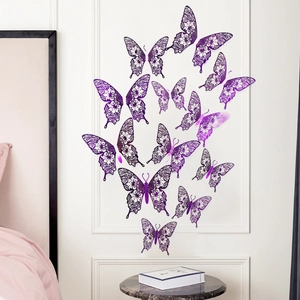 Detailed view of 3D purple hollow butterfly wall stickers with lace patterns on a bedroom wall