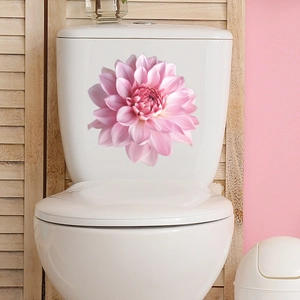 Detail showing self-adhesive pink dahlia flower sticker on white ceramic toilet tank